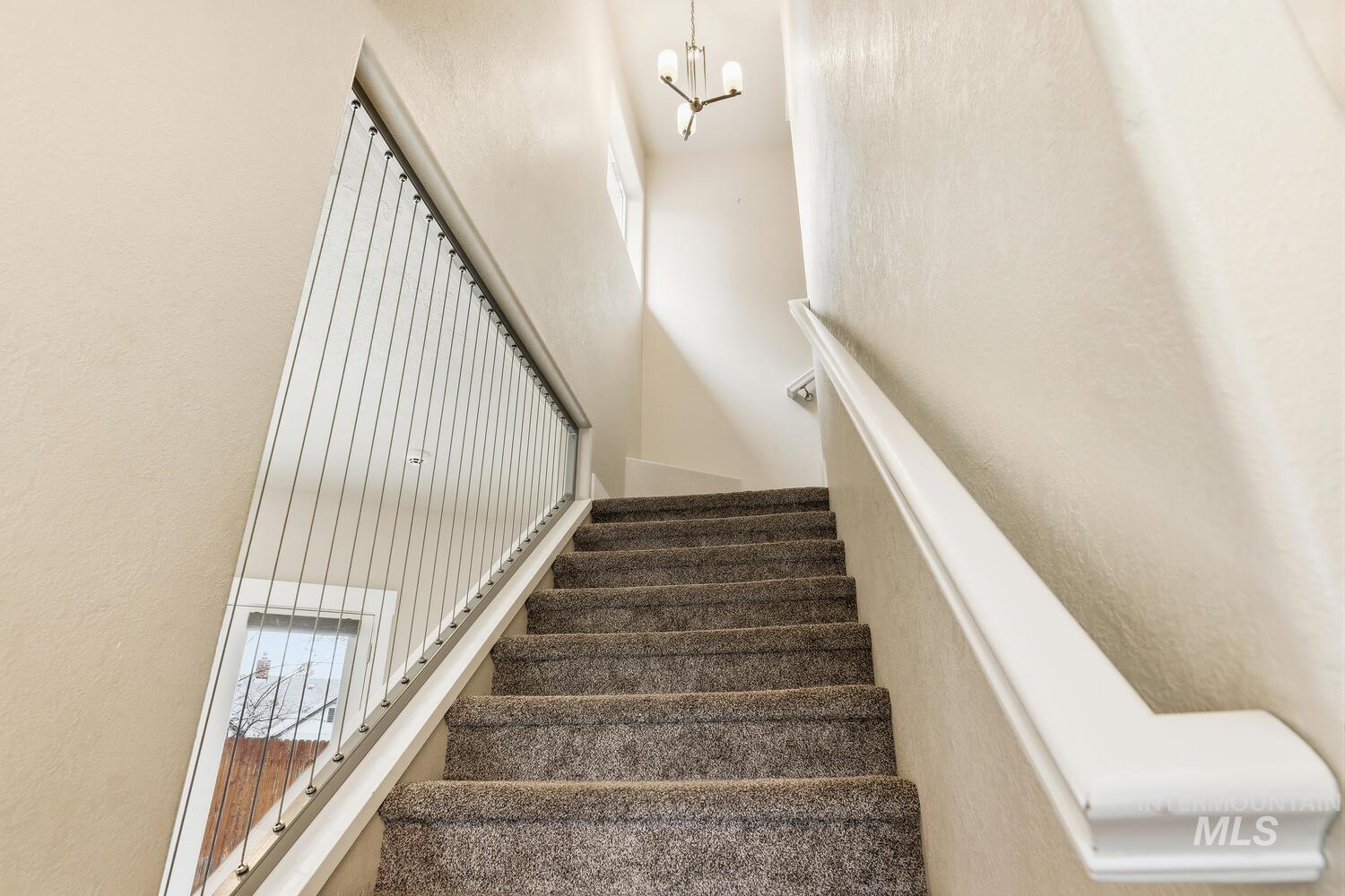 3003 West Moore Street Boise, ID 83702 - Photo 15 of 35 Stairs with suspended lighting