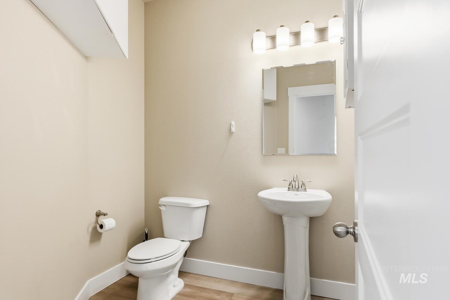 3003 West Moore Street Boise, ID 83702 - Photo 29 of 35 Bathroom with toilet and light wood finished floors