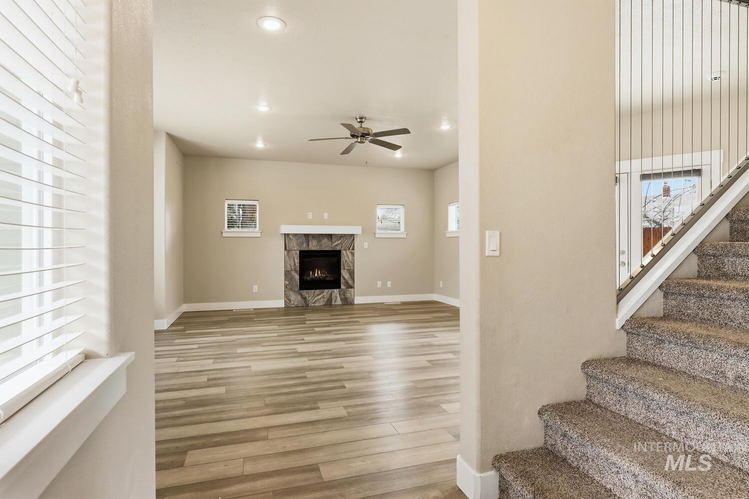 3003 West Moore Street Boise, ID 83702 - Photo 5 of 35 Living area with ceiling fan, light wood-type flooring, a fireplace, and recessed lighting