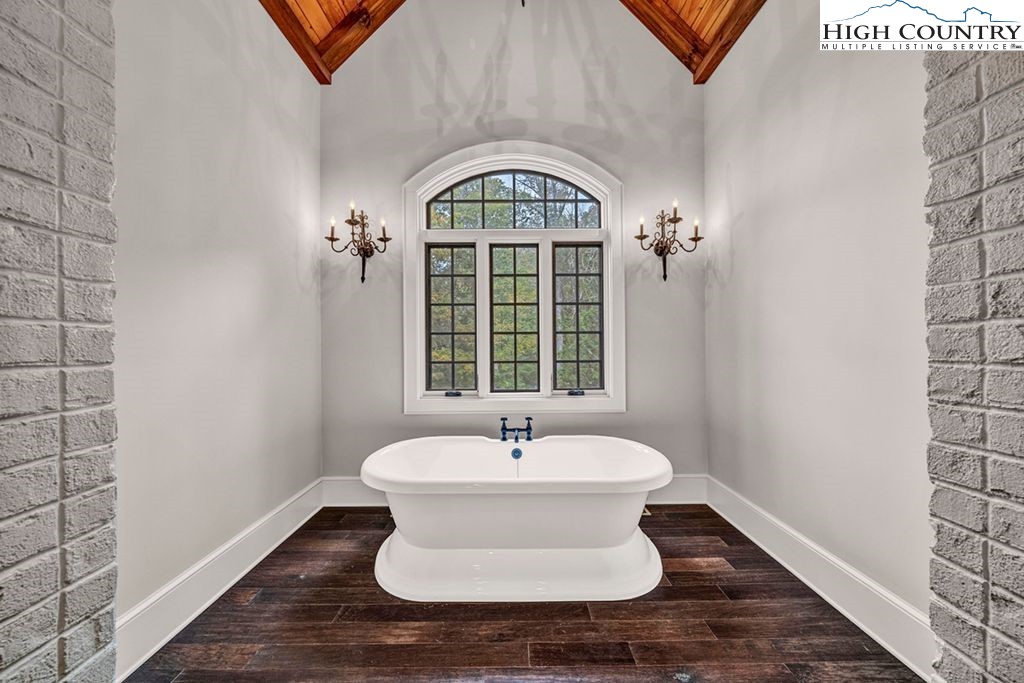 906 Fox Meadow Road Banner Elk, NC 28604 - Photo 18 of 40 a bathroom with a sink and a mirror