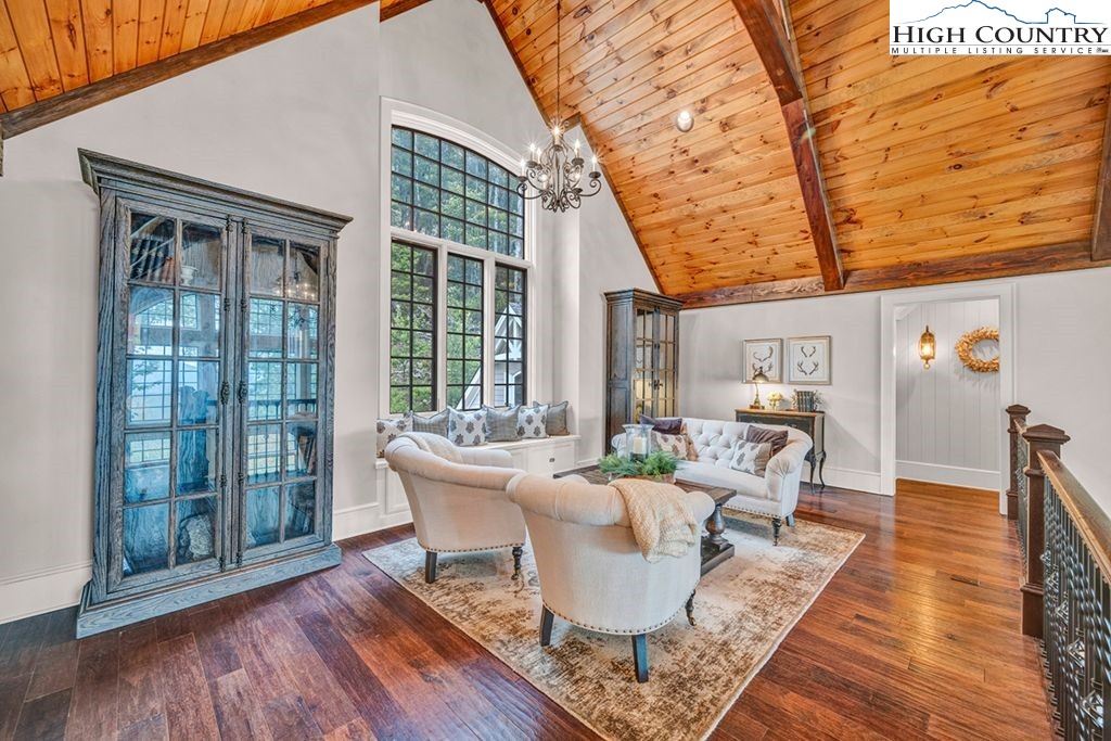 906 Fox Meadow Road Banner Elk, NC 28604 - Photo 22 of 40 a dining room with furniture and wooden floor