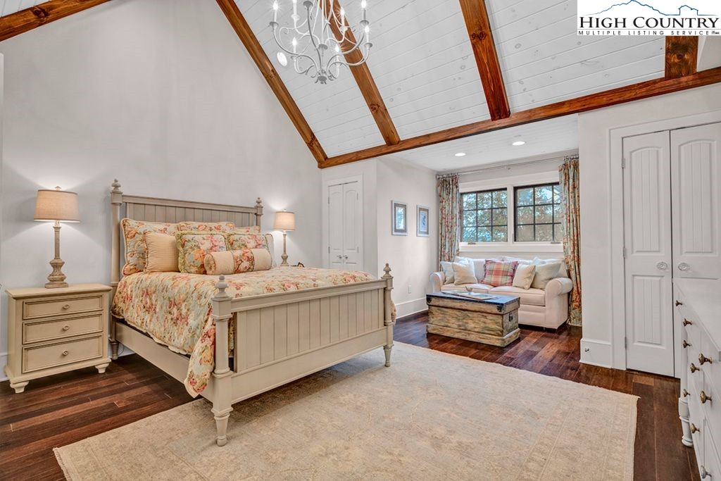 906 Fox Meadow Road Banner Elk, NC 28604 - Photo 23 of 40 a bedroom with a bed couch and a window