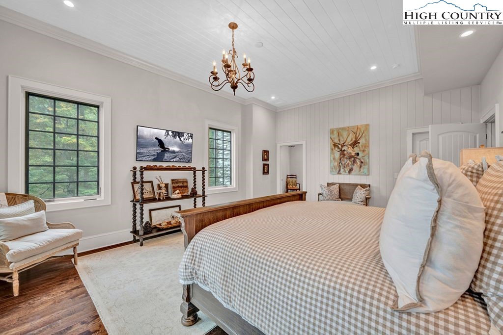 906 Fox Meadow Road Banner Elk, NC 28604 - Photo 32 of 40 a bedroom with a bed furniture and a window