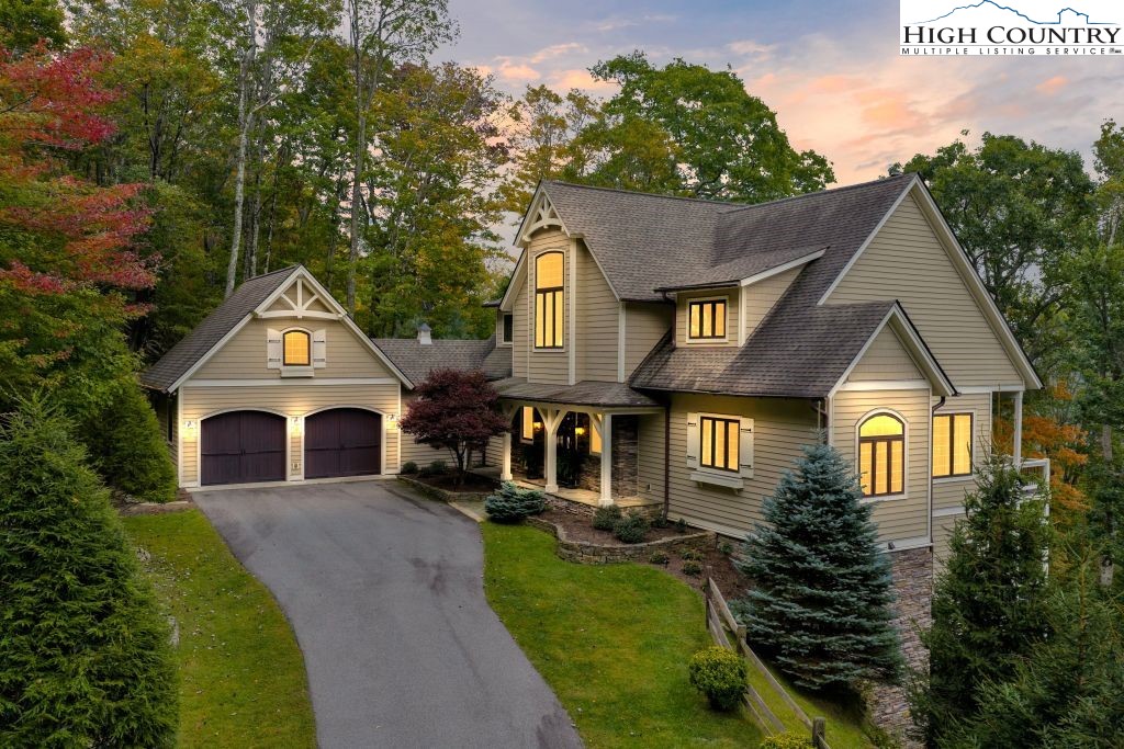 906 Fox Meadow Road Banner Elk, NC 28604 - Photo 34 of 40 a front view of a house with garden