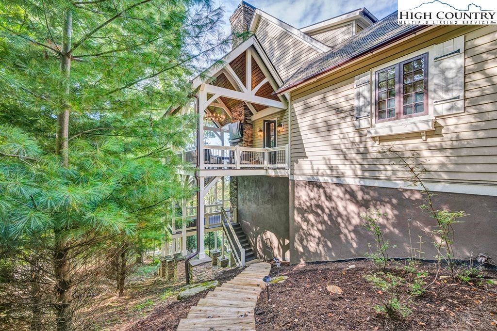 906 Fox Meadow Road Banner Elk, NC 28604 - Photo 36 of 40 a front view of a house with a yard