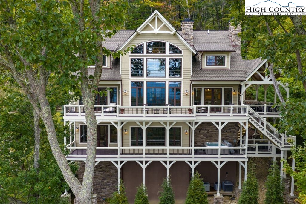 906 Fox Meadow Road Banner Elk, NC 28604 - Photo 37 of 40 a front view of a house with a yard and balcony