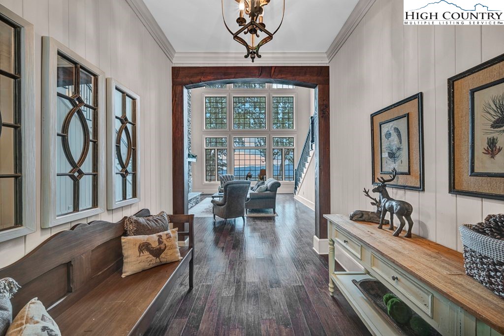 906 Fox Meadow Road Banner Elk, NC 28604 - Photo 7 of 40 a living room with furniture large window and wooden floor
