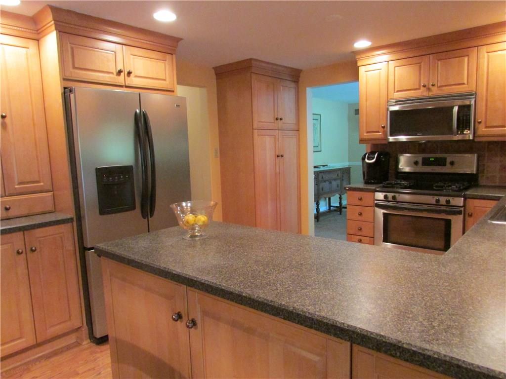 KITCHEN - Two large pantries, and abundant cabinets can easily store an enormous amount of kitchen equipment and food items.