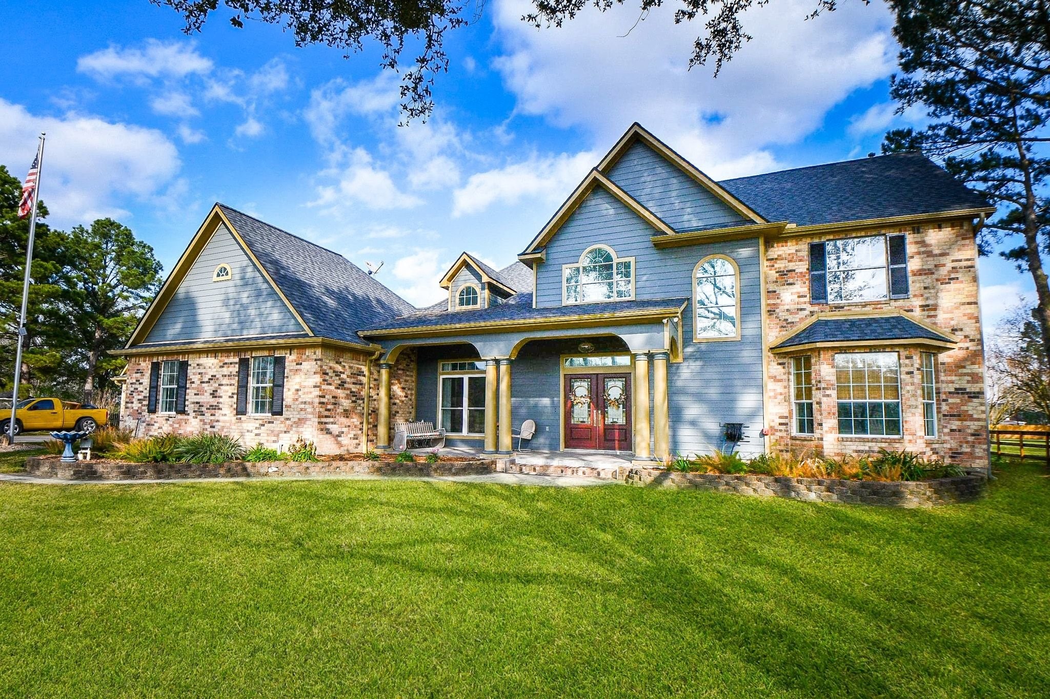 This magnificent 2-story brick gem with covered front porch/entrance, offers peace and solitude in nature's grove!