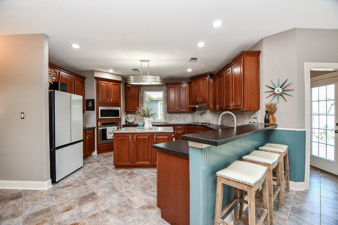 3680 Eula Morgan Road Katy, TX 77493 - Photo 10 of 50 This divine kitchen area is nothing short of a cook's/host's dream 'workshop'! Generous walking paths around the center island, lined with counters that go on forever, make everyday and special day tasking, a breeze!