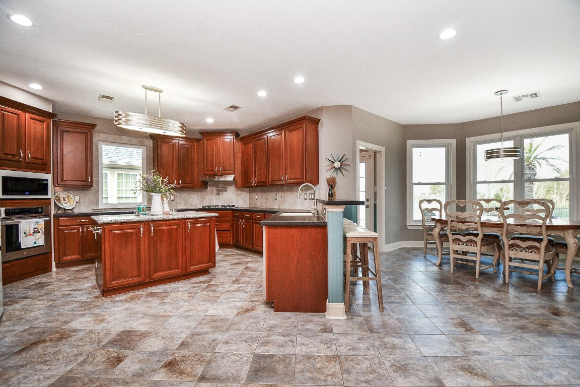 3680 Eula Morgan Road Katy, TX 77493 - Photo 11 of 50 A wall of big windows (right) lines the substantial breakfast/casual dining nook, easily accessed from its roomy kitchen.