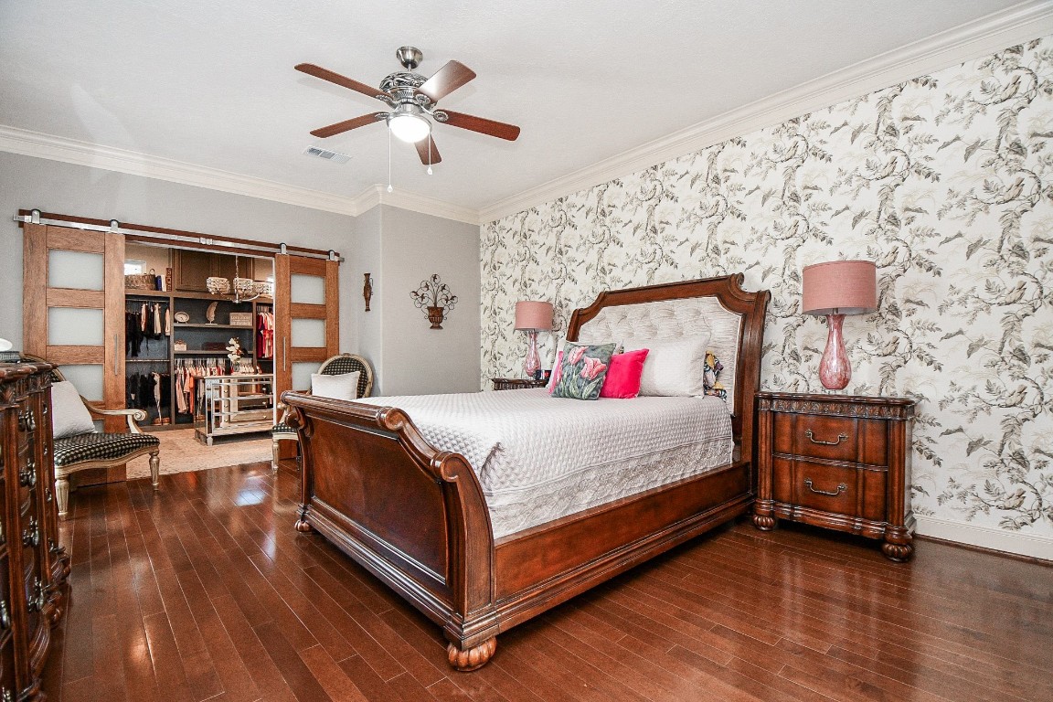 3680 Eula Morgan Road Katy, TX 77493 - Photo 14 of 50 In case you haven't decided, this is the epitome of peaceful, private elegance in a primary suite like no other. And, what comprises the most warming features? Quality simplicity! Wall and floor dimensions are amazing, as is the sliding door treatment as you enter an unequalled walk-in closet, up left center.