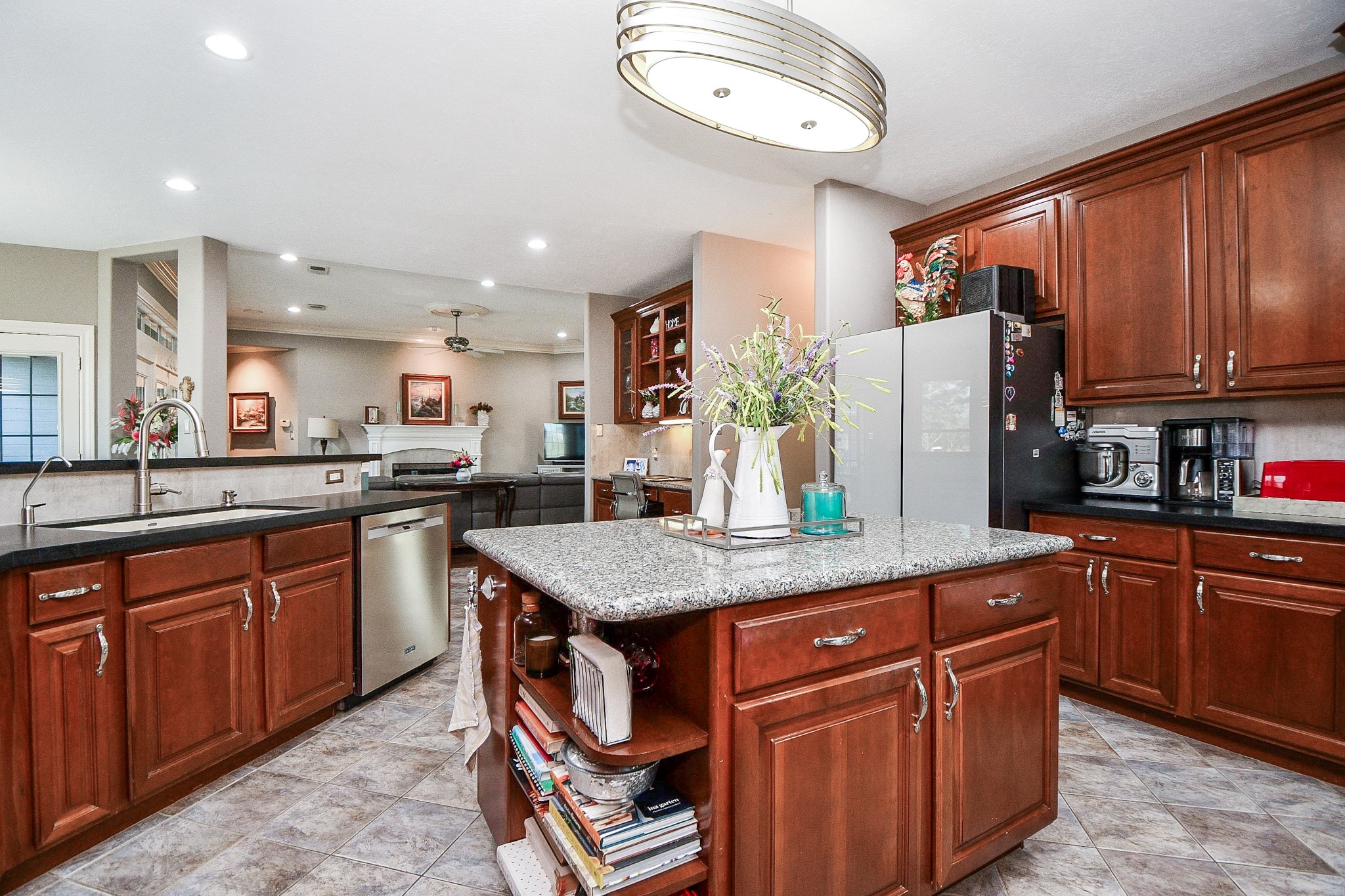 3680 Eula Morgan Road Katy, TX 77493 - Photo 17 of 50 Comfort and convenience reign at every step and turn with necessary storage, counters and cabinetry wherever you need it to be. Creamy granite counters and neutral toned tile backsplash make tasking every easier.