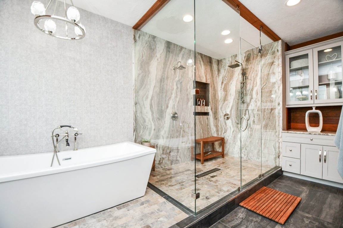 3680 Eula Morgan Road Katy, TX 77493 - Photo 18 of 50 Sensually satisfying contemporary lines fill your primary ensuite bath, with long, rectangular soaking tub, sitting right next to the spacious, walk-in, glass enclosed shower.