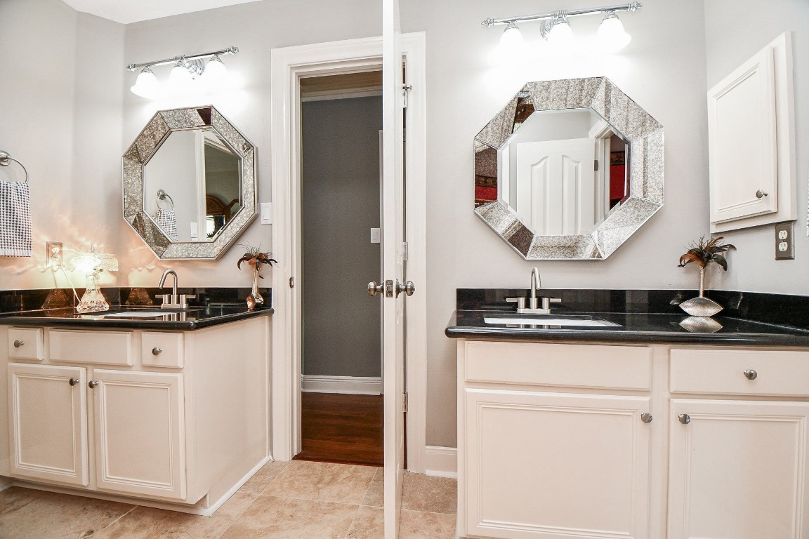 3680 Eula Morgan Road Katy, TX 77493 - Photo 28 of 50 A charming bit of art-deco nostalgia defines this gleaming Jack and Jill secondary bath between secondary bedrooms 1 and 2