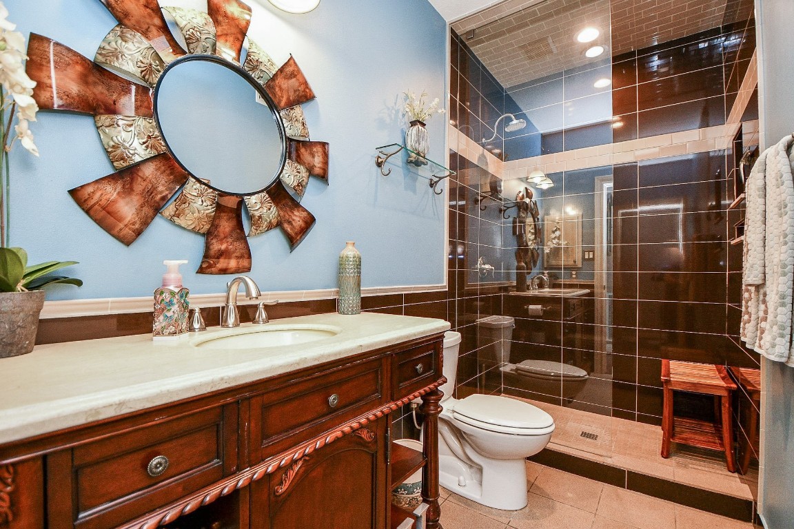 3680 Eula Morgan Road Katy, TX 77493 - Photo 31 of 50 This secondary bath will waken your senses, with dramatic wall mirror and cedar/stone toned amenities. This is next to the first floor secondary bedroom by hallway and also utilized off the family room.