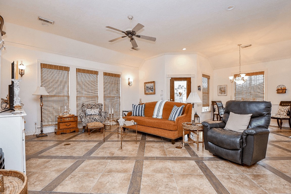3680 Eula Morgan Road Katy, TX 77493 - Photo 42 of 50 This huge living area in the guest house welcomes sizeable pieces! Notice the custom floor motif with tile and wood.