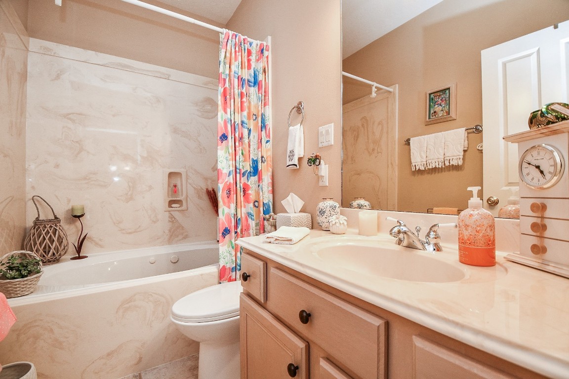 3680 Eula Morgan Road Katy, TX 77493 - Photo 45 of 50 Muted earth tones bathe this secondary bathroom in the guest house (with combined shower/bathtub) in warm vibes.