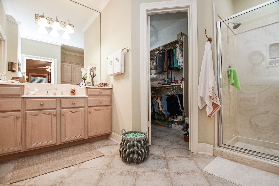 3680 Eula Morgan Road Katy, TX 77493 - Photo 48 of 50 A primary ensuite bathroom for the primary bedroom in the Guest House also offers a substantial walk-in closet.
