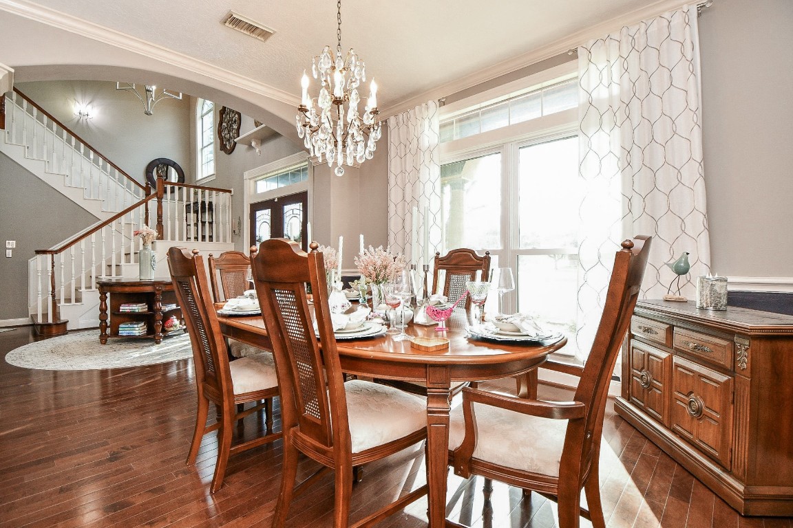 3680 Eula Morgan Road Katy, TX 77493 - Photo 6 of 50 Upscale privacy is absolutely possible in this gorgeous formal dining space, bathed in pure natural sunshine, with a warm view into the main entry foyer and divine staircase. Gleaming floors also reflect the light.