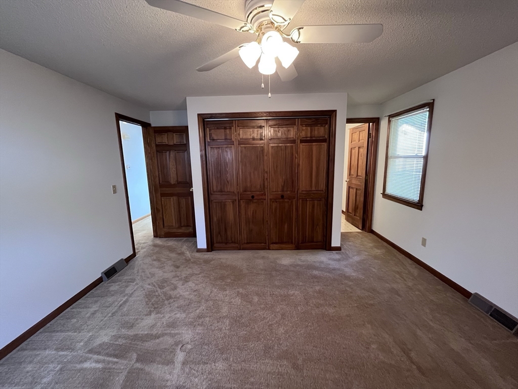 48 Peekskill Avenue Springfield, MA 01129 - Photo 18 of 23 an empty room with windows and fan