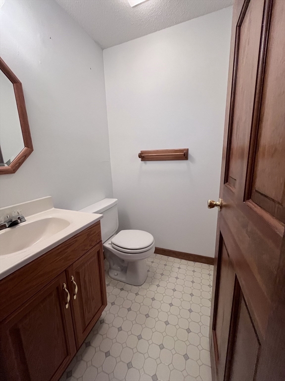 48 Peekskill Avenue Springfield, MA 01129 - Photo 20 of 23 a bathroom with a sink a toilet and a mirror