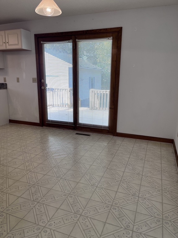 48 Peekskill Avenue Springfield, MA 01129 - Photo 4 of 23 a view of an empty room with a window