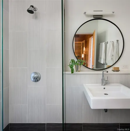 a bathroom with a sink and mirror