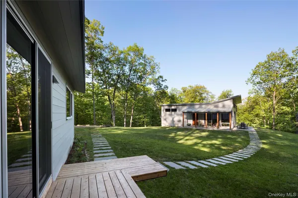 aerial view of a house with a yard