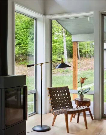a living room with a table and a fireplace
