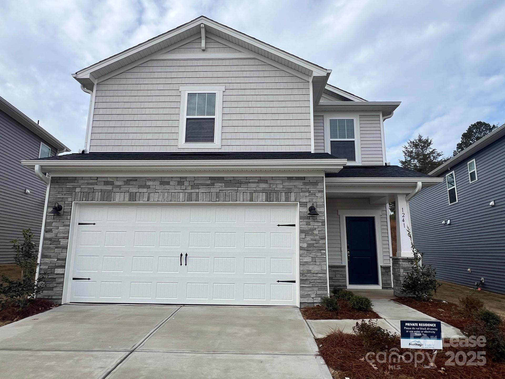 1241 30th St Lane Northeast Conover, NC 28613 - Photo 19 of 19 a front view of a house with garage
