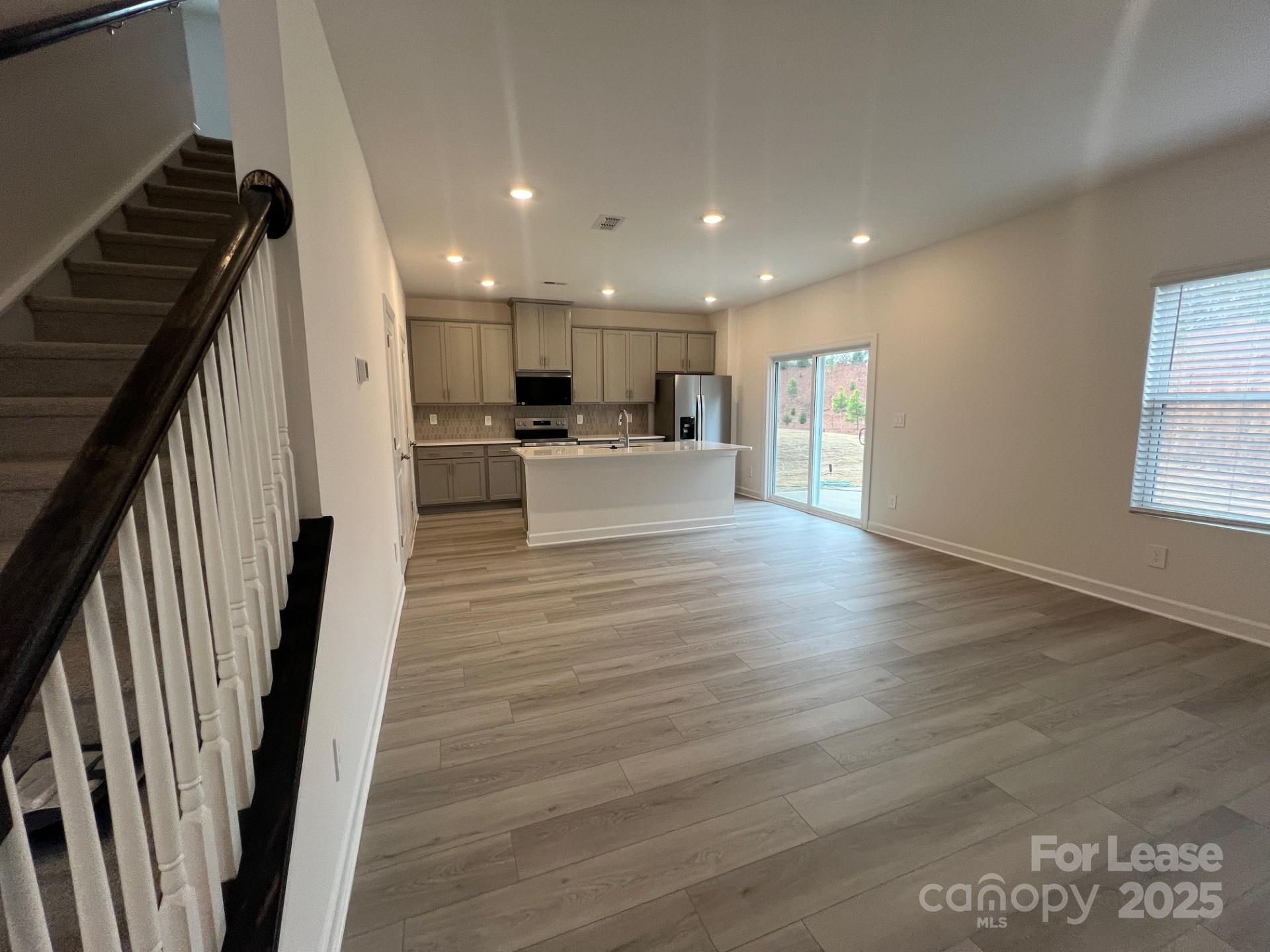1241 30th St Lane Northeast Conover, NC 28613 - Photo 2 of 19 a view of a living room with furniture and wooden floor