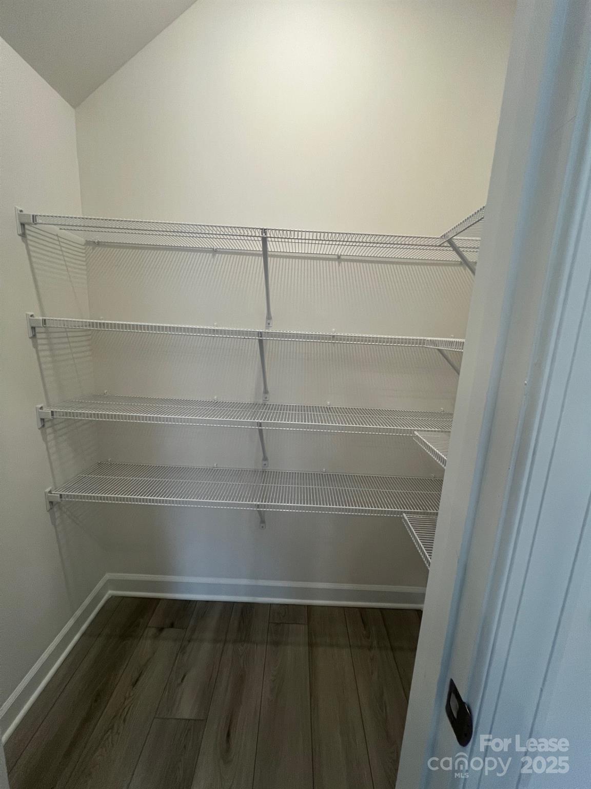 1241 30th St Lane Northeast Conover, NC 28613 - Photo 5 of 19 a view of walk in closet with empty racks