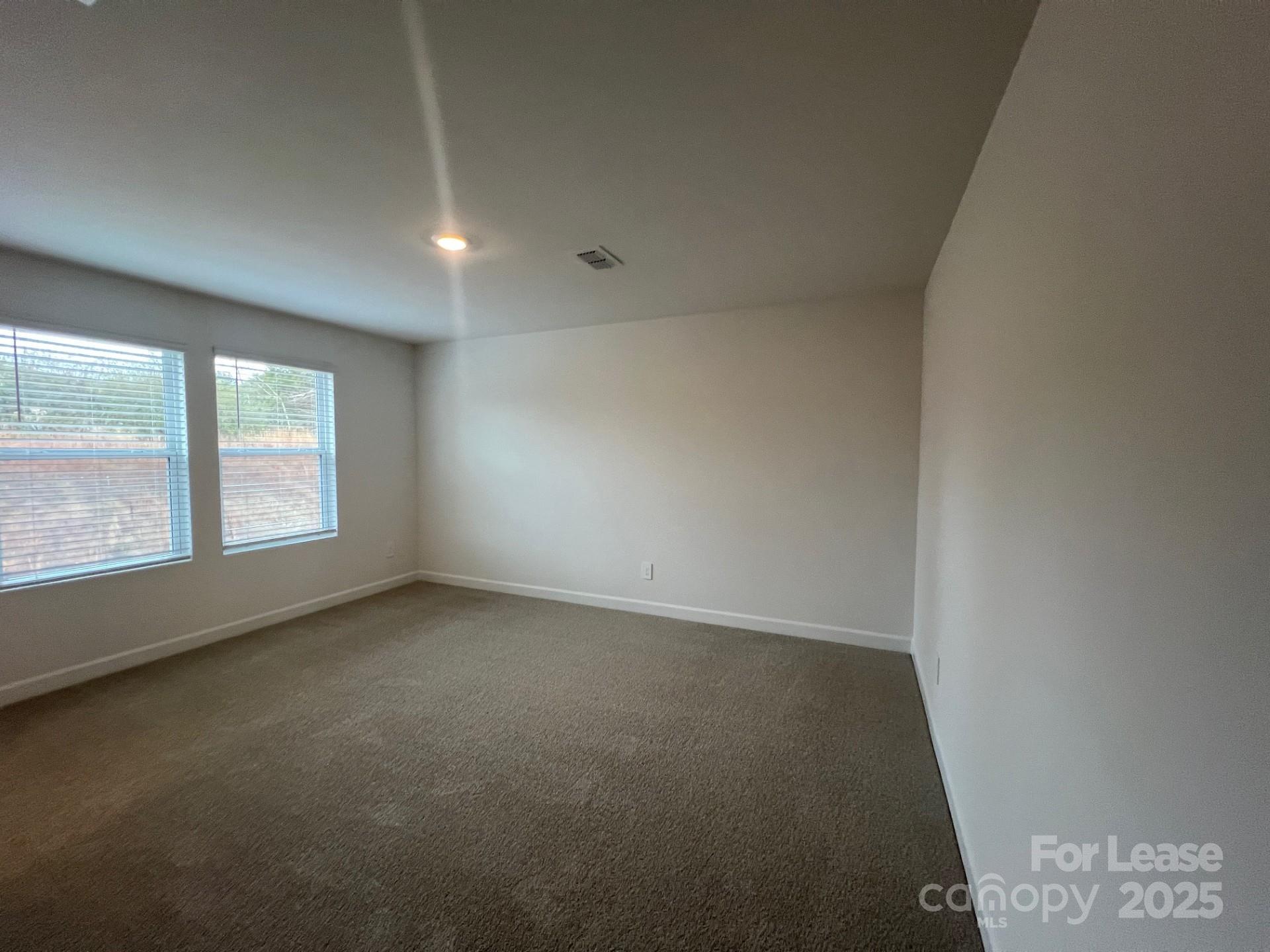 1241 30th St Lane Northeast Conover, NC 28613 - Photo 8 of 19 an empty room with a window