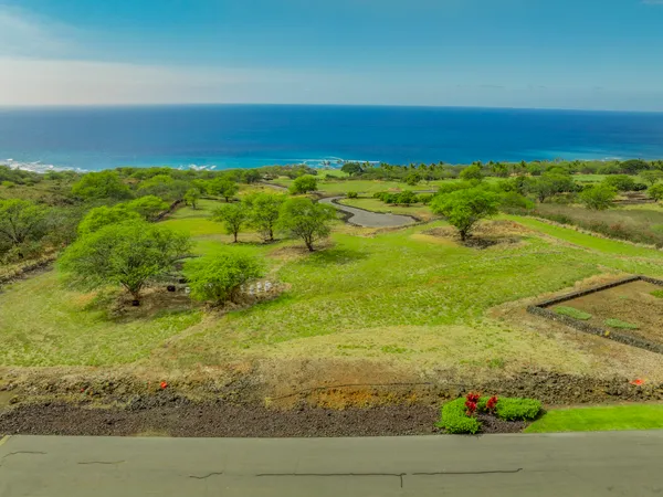a view of a yard with an ocean
