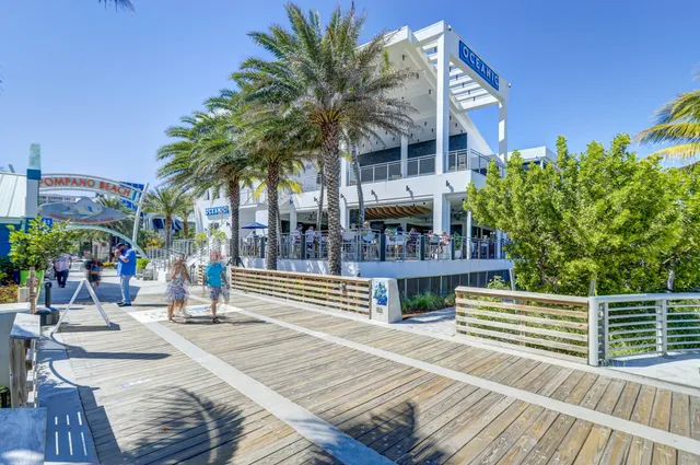 a tall building with trees in the background