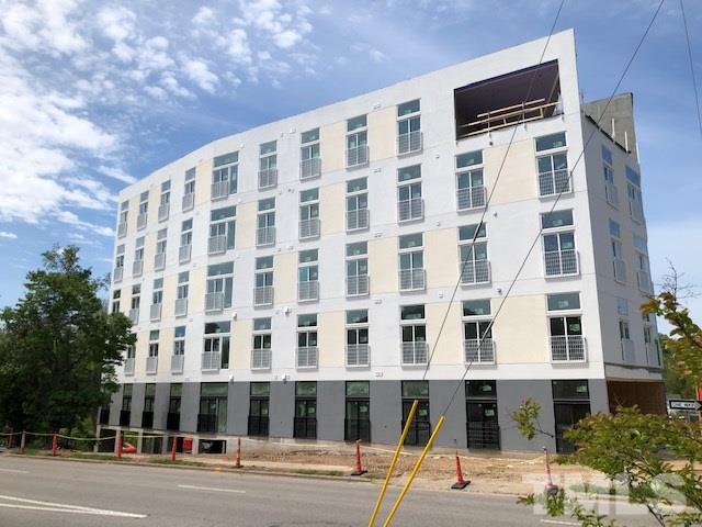 a view of a building with a street