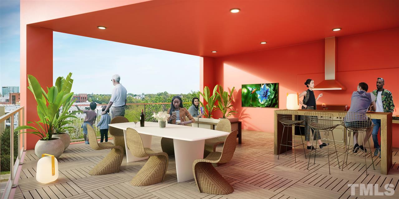 600 South Duke Street, Unit 11 Durham, NC 27701 - Photo 7 of 12 a living room with furniture a rug and a floor to ceiling window