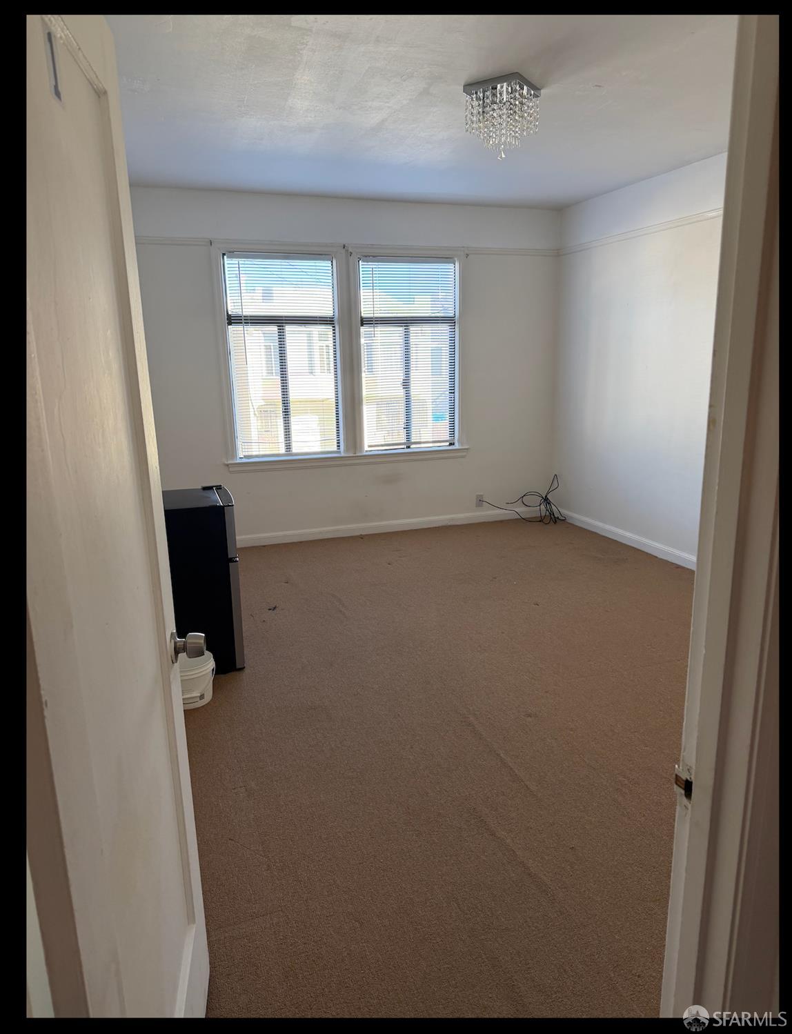 247 Brighton Avenue San Francisco, CA 94112 - Photo 3 of 11 an empty room with a window