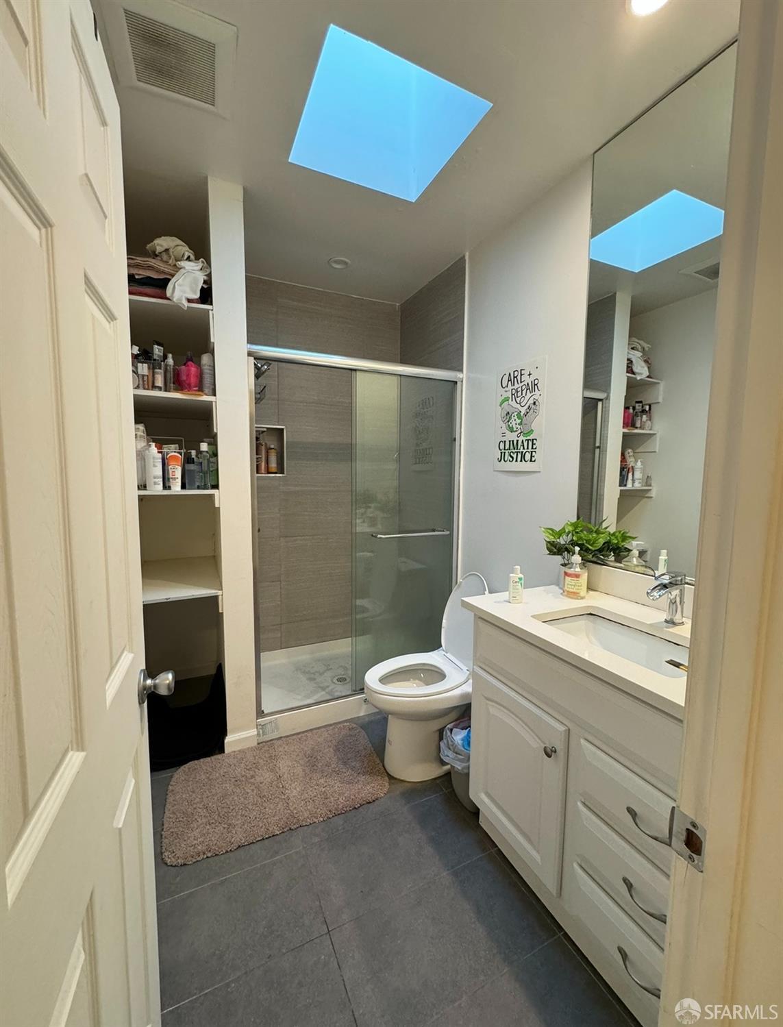 247 Brighton Avenue San Francisco, CA 94112 - Photo 8 of 11 a bathroom with a toilet a sink and shower