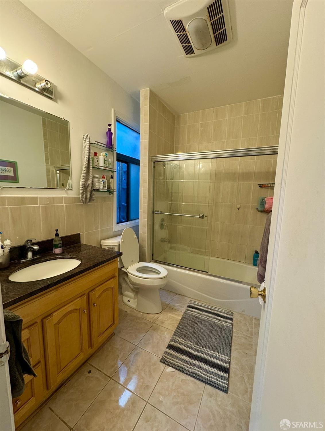 247 Brighton Avenue San Francisco, CA 94112 - Photo 9 of 11 a bathroom with a sink a toilet and shower