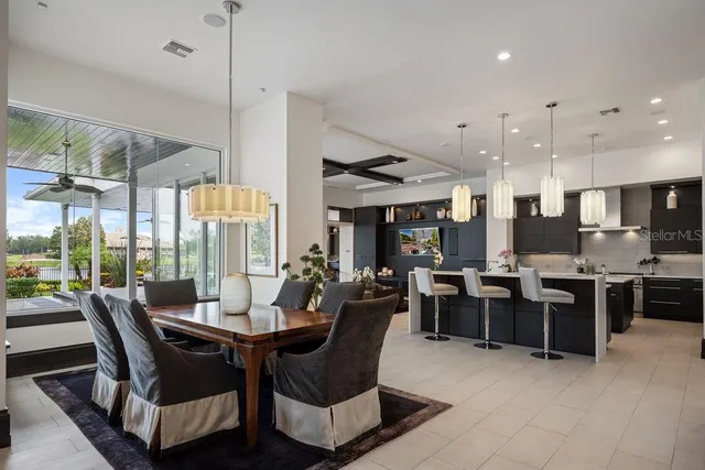 a living room with furniture tv and large window