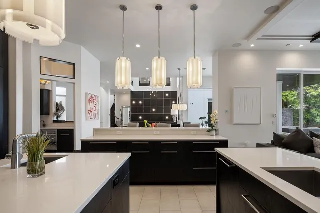 a bathroom with a granite countertop sink toilet mirror and shower