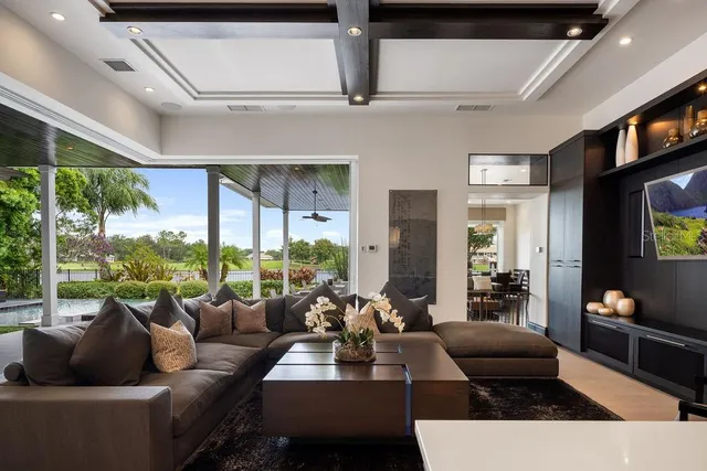 a living room with fireplace furniture and a flat screen tv