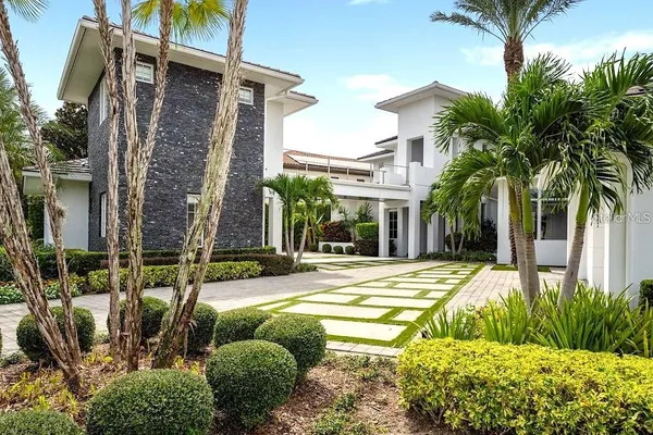 a living room with furniture and dining room