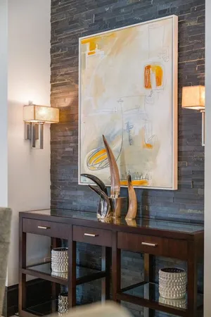 a bathroom with a granite countertop sink toilet a mirror and shower