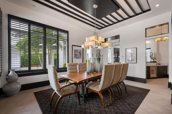 a view of a patio with a table and chairs