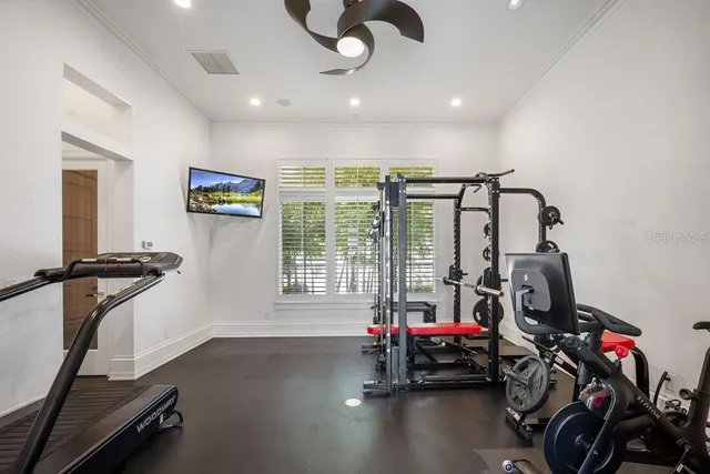 a view of a hallway with wooden floor and stairs