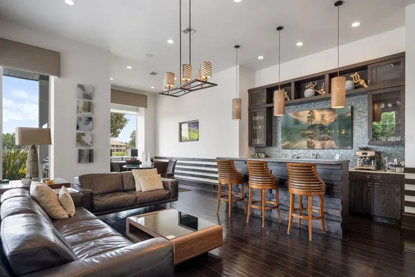 an aerial view of lake and residential houses with outdoor space