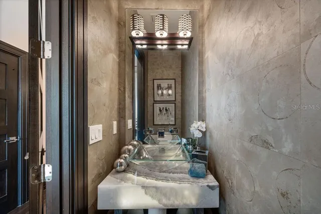 a view of a workspace with furniture and a flat screen tv